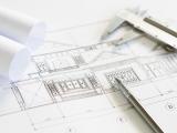 Construction plans and drawing tools on blueprints